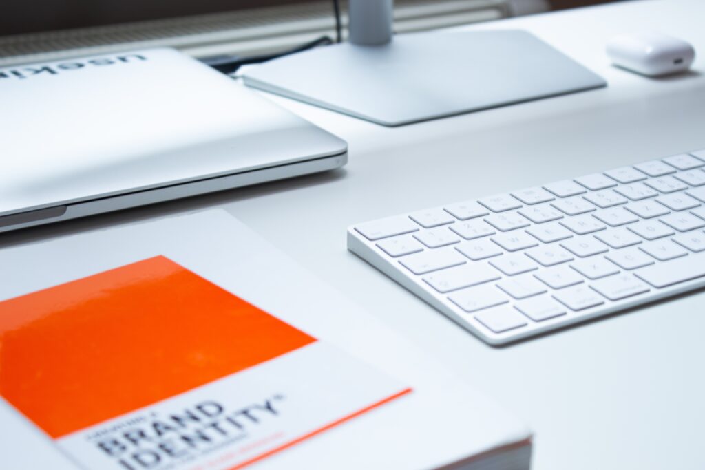 A clean workspace with a brand identity book, highlighting the simplicity in brand messaging.